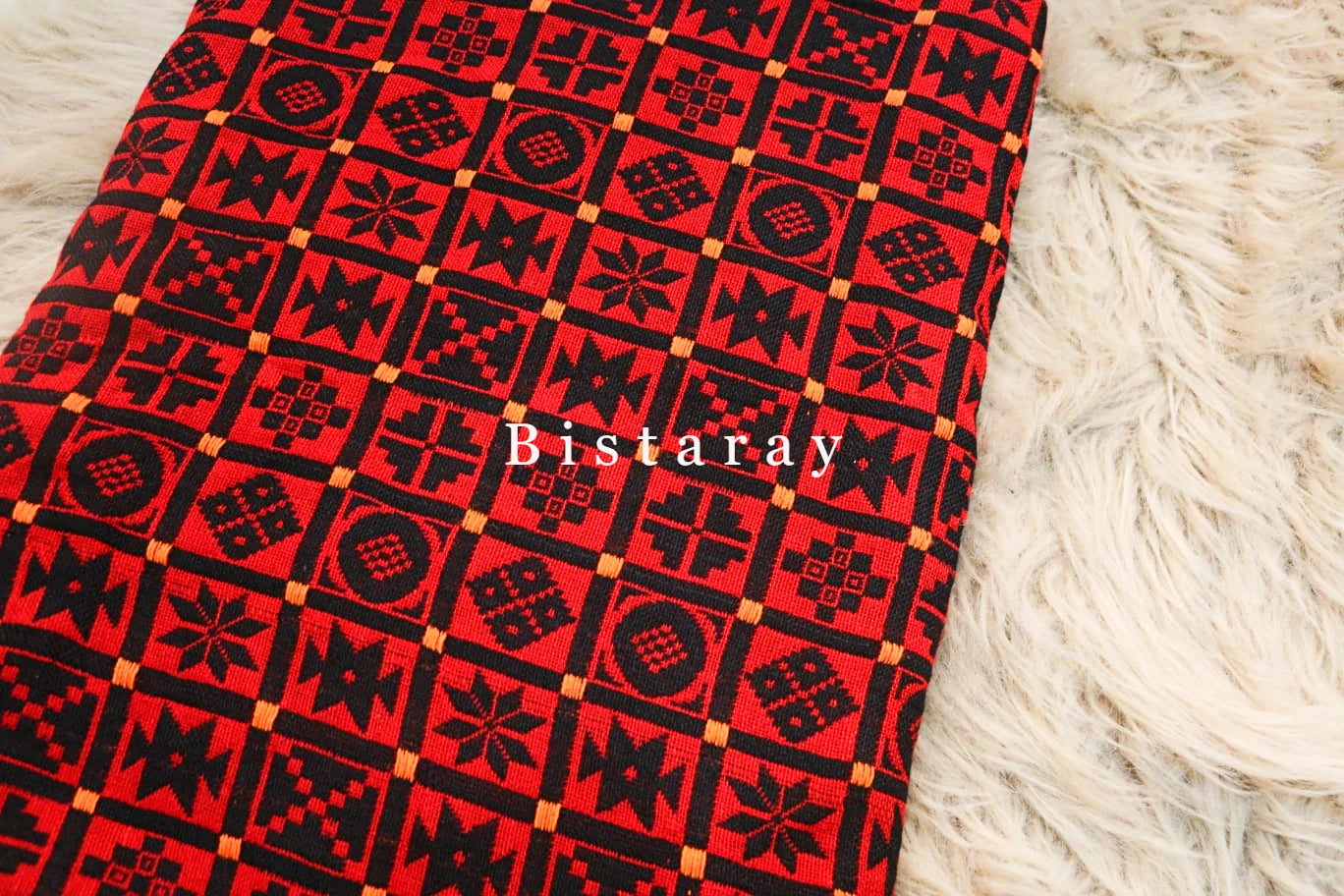 Red and black patterned fabric with 'Bistaray' branding on a white textured background