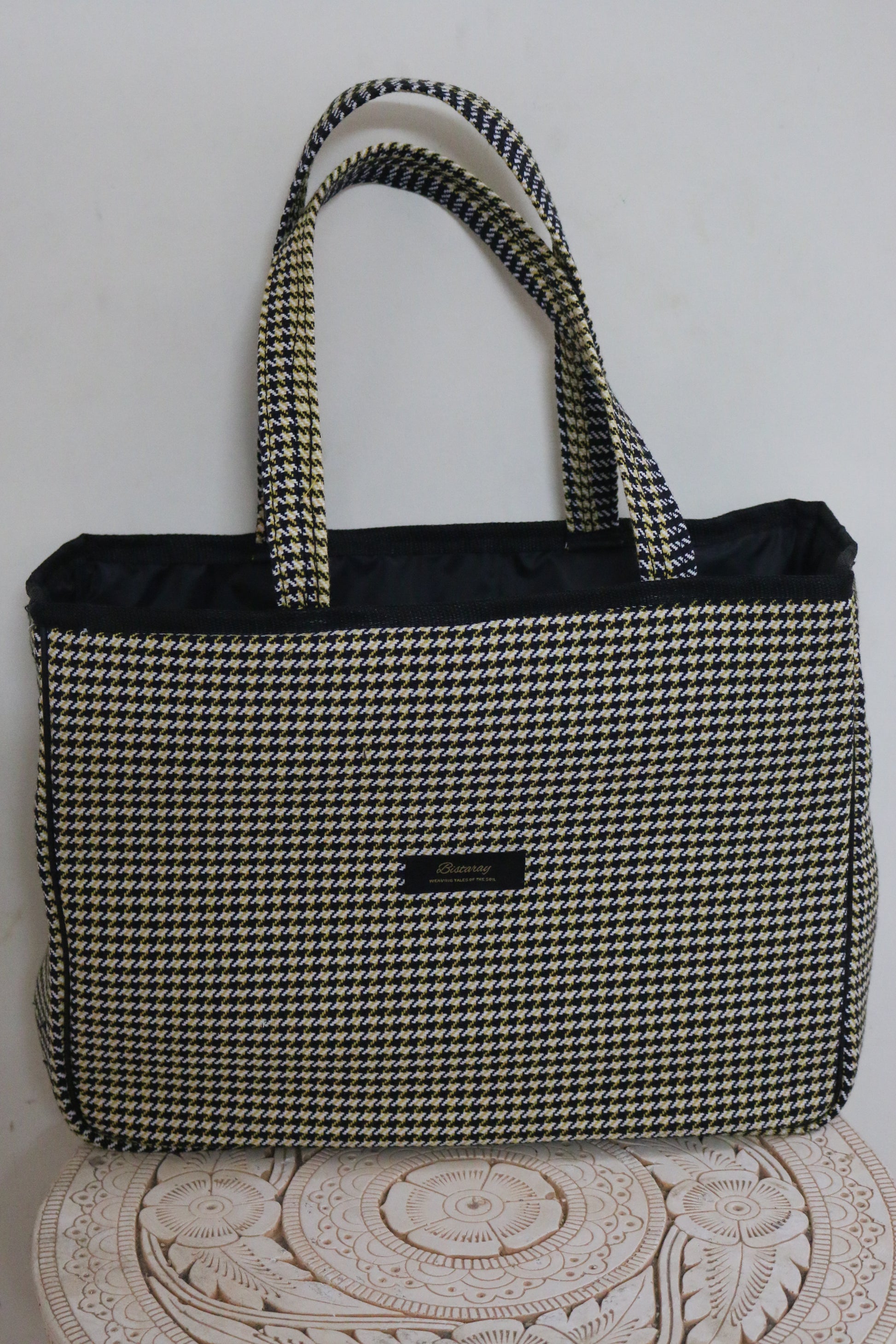 Houndstooth cloth tote bag with reinforced handles
Stylish fabric tote bag featuring houndstooth pattern
Reusable houndstooth shopping bag made from durable cloth
Spacious black and white houndstooth tote for everyday use
Eco-friendly cloth tote with classic houndstooth design