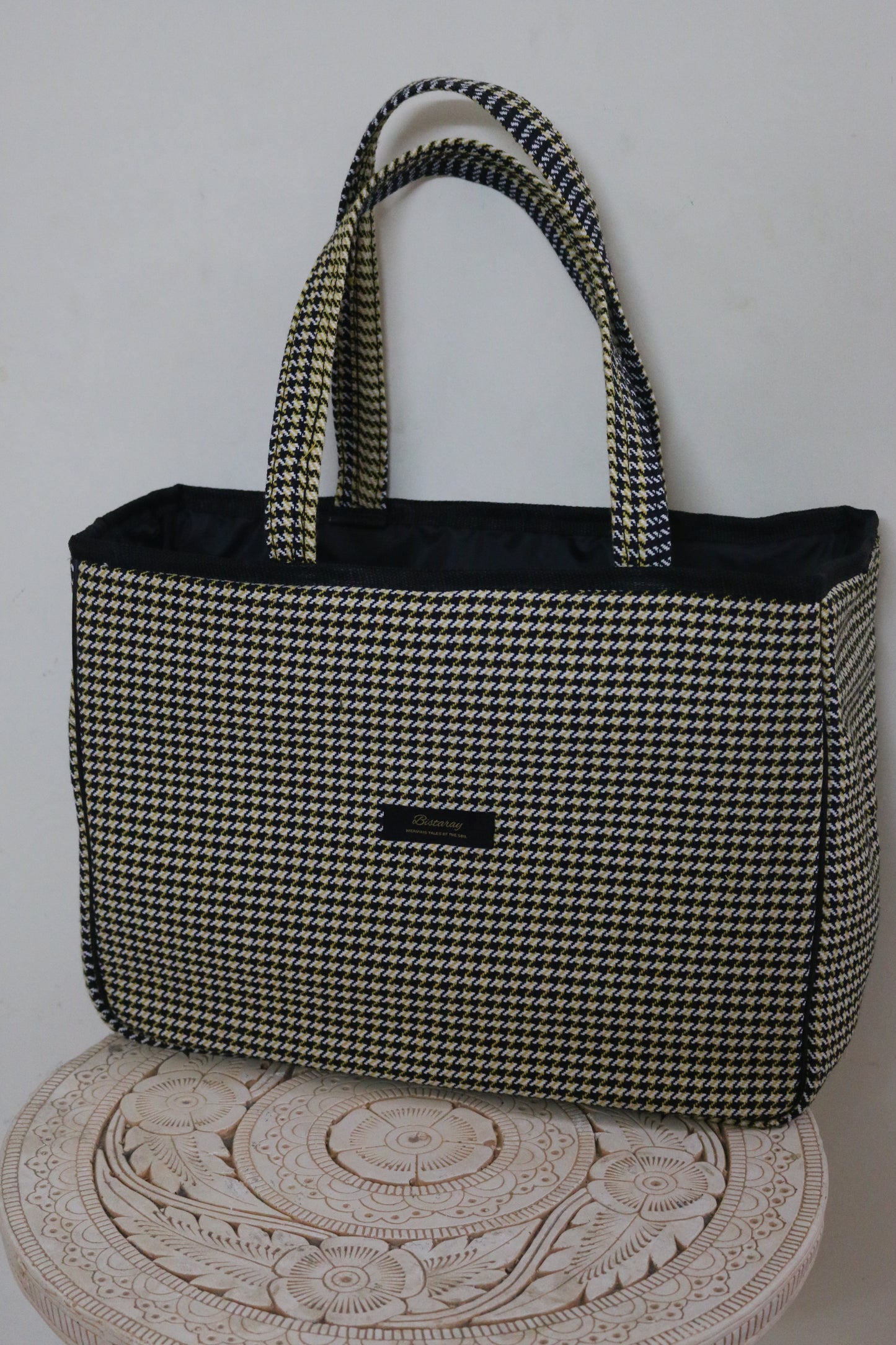 Houndstooth cloth tote bag with reinforced handles
Stylish fabric tote bag featuring houndstooth pattern
Reusable houndstooth shopping bag made from durable cloth
Spacious black and white houndstooth tote for everyday use
Eco-friendly cloth tote with classic houndstooth design