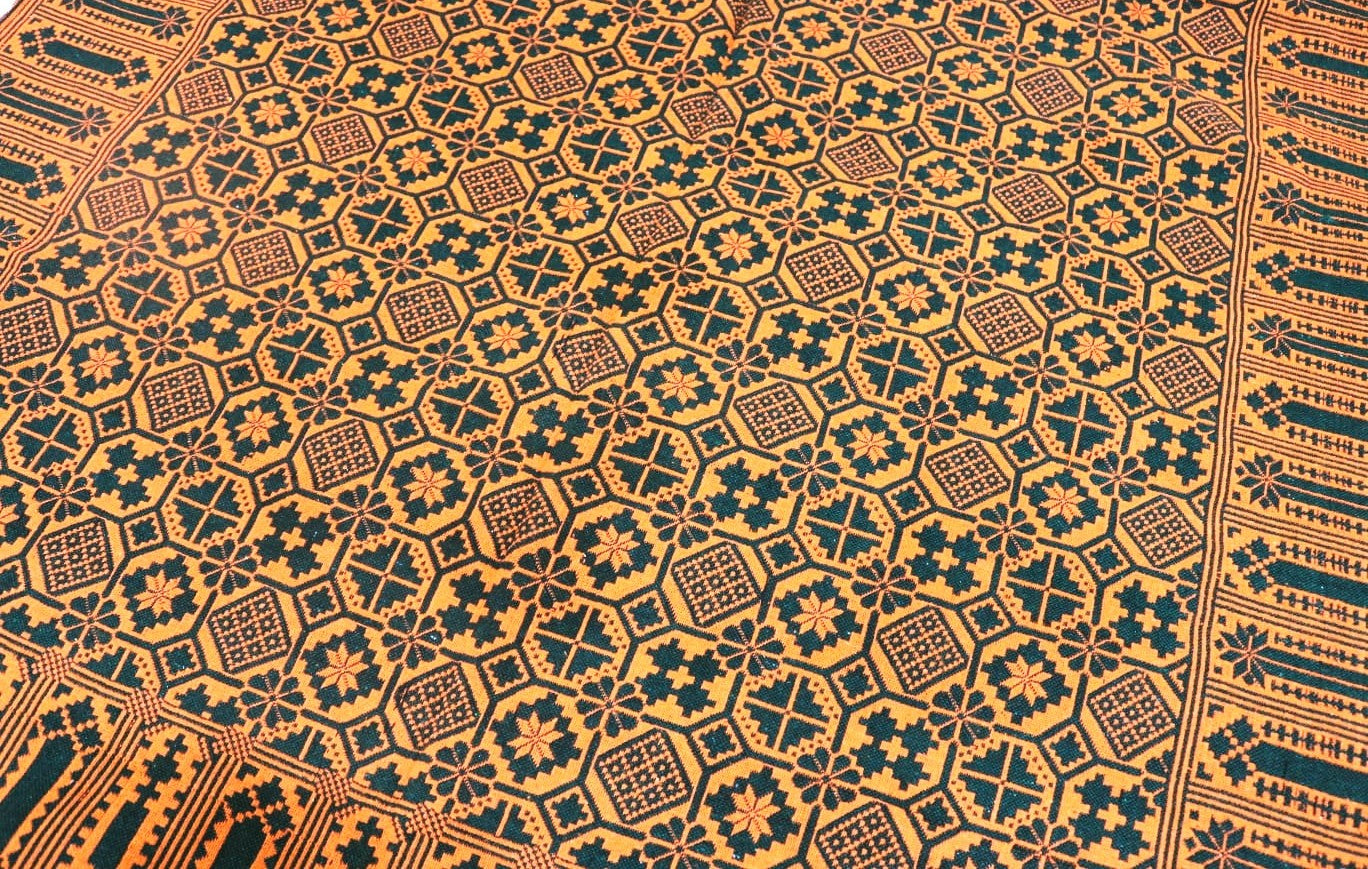Close-up of a patterned khes fabric with geometric design