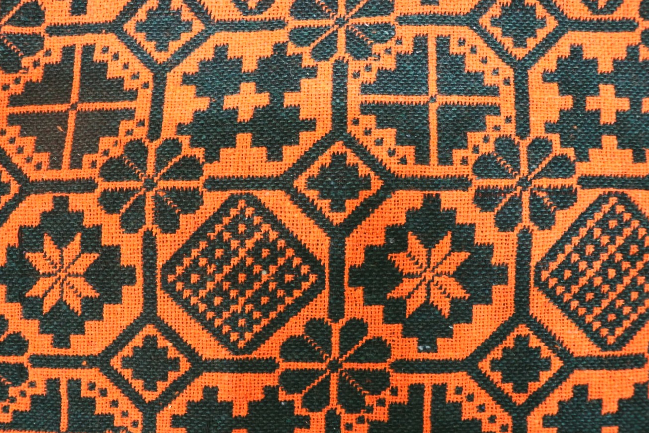 Close-up of orange and green geometric patterned fabric