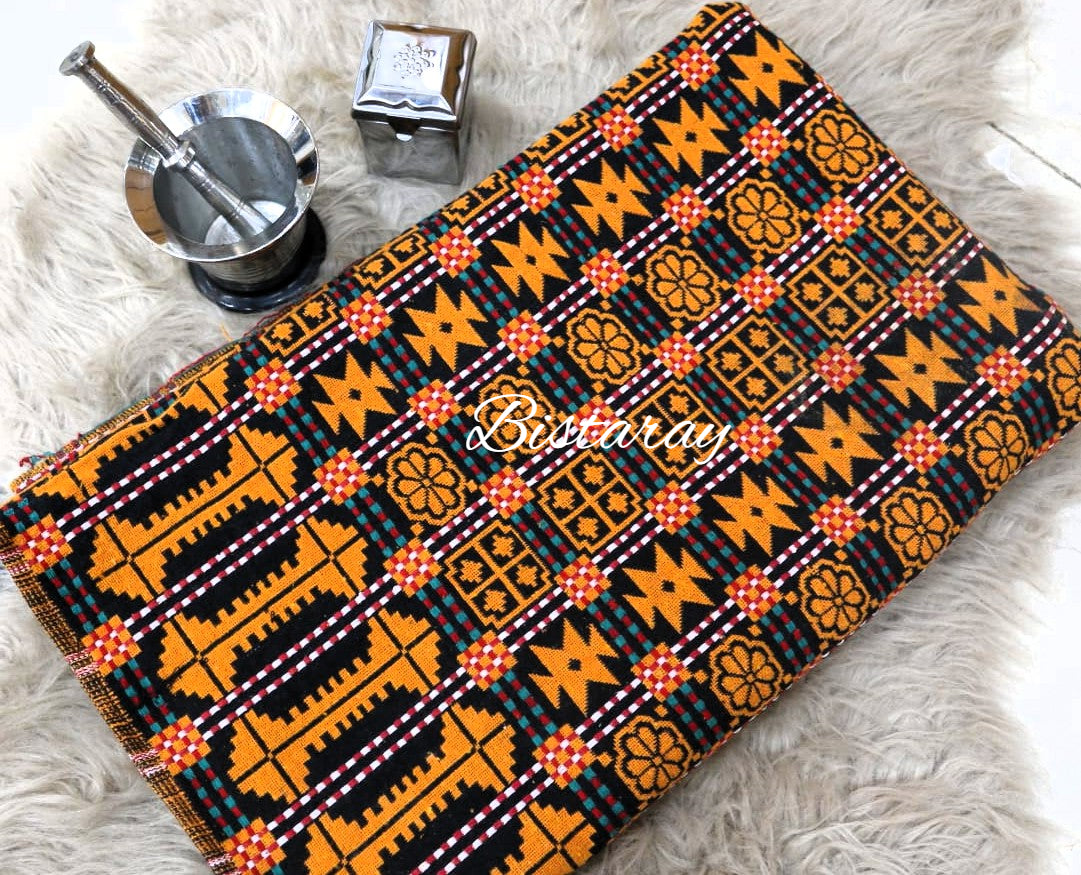 Khes Fabric with orange and black geometric pattern on a white surface
