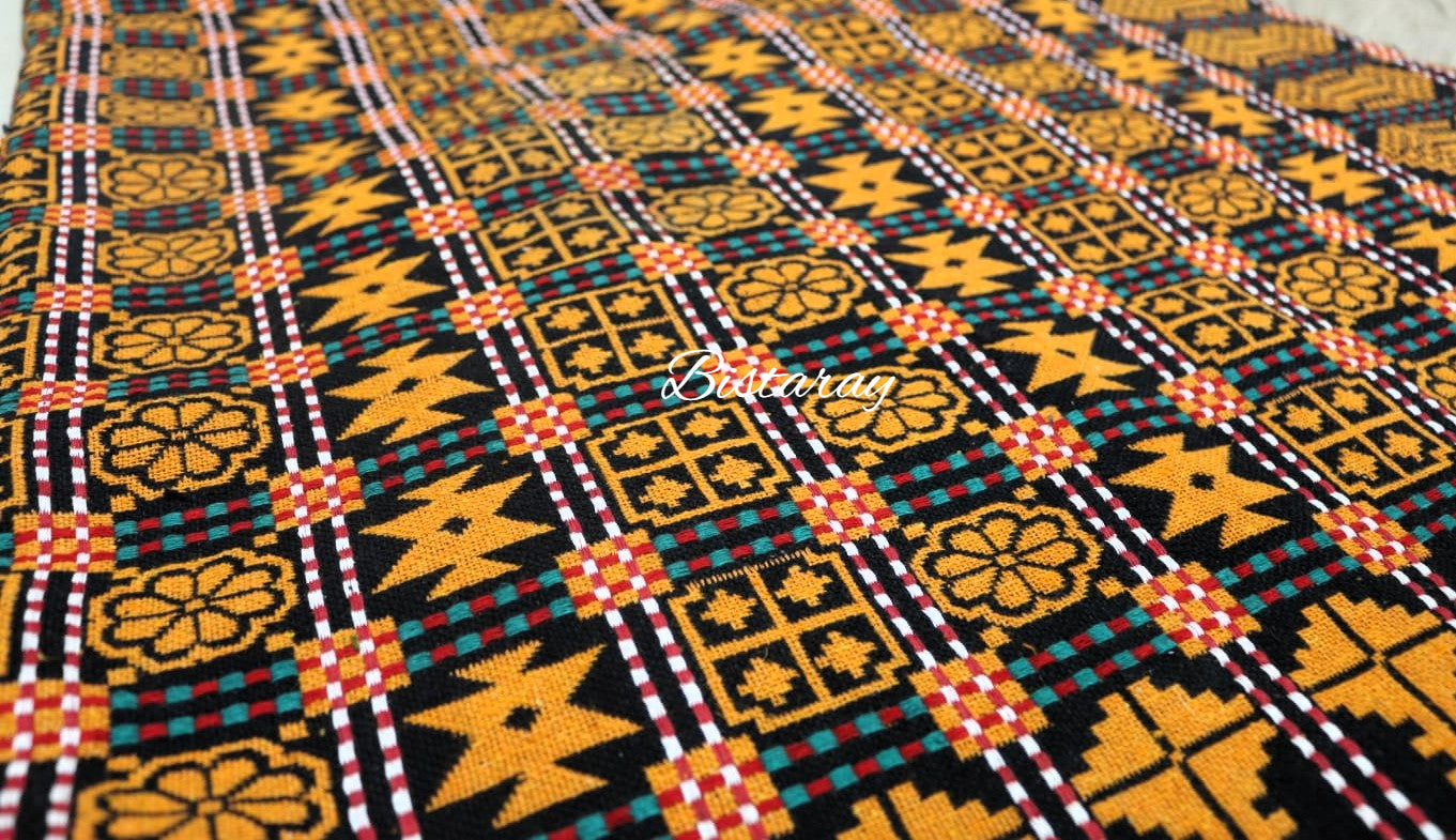 Patterned khes fabric with geometric design in yellow, black, and red on a black background