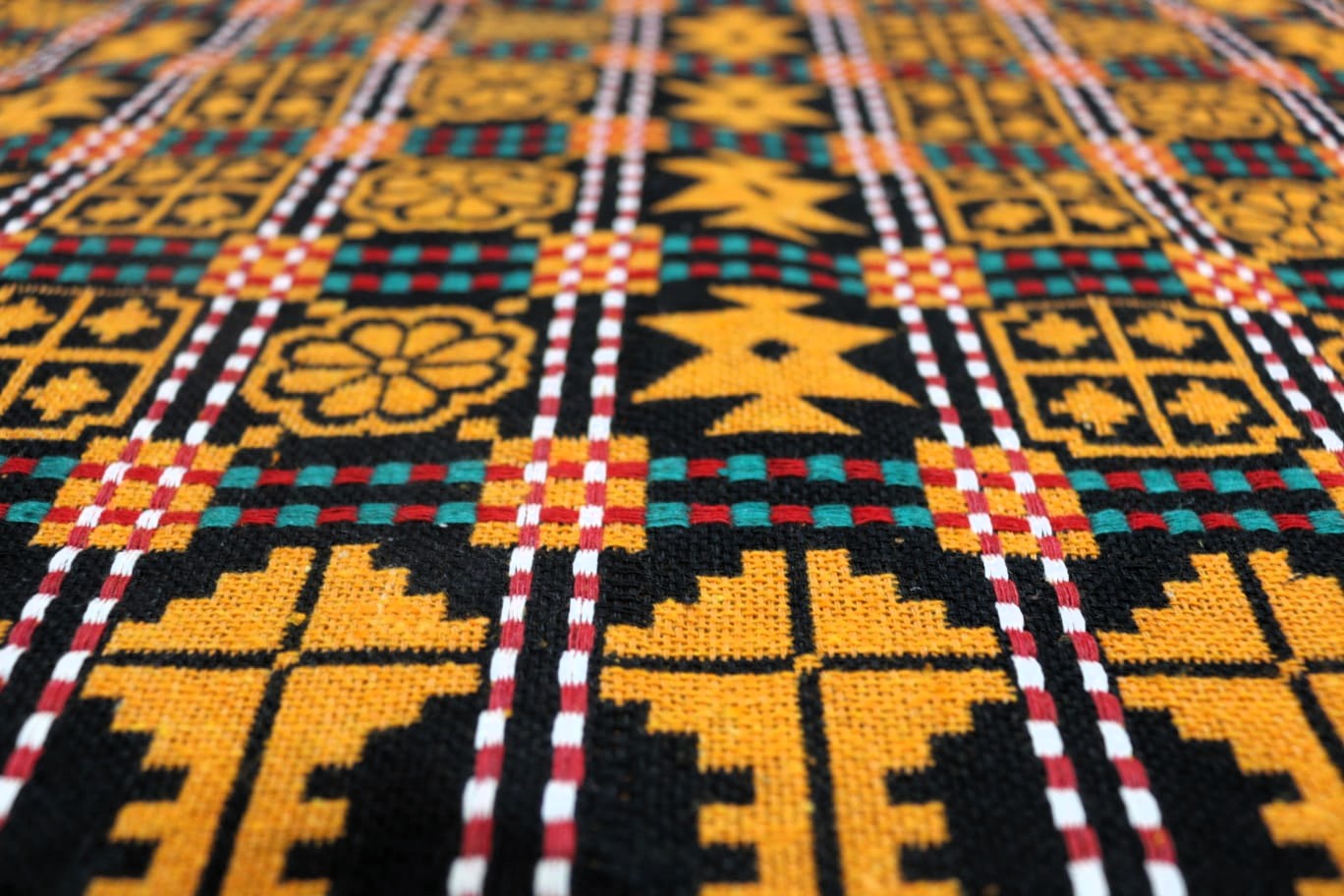 Close-up of a colorful woven fabric with geometric patterns