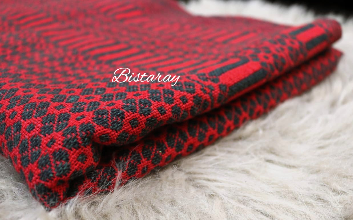 Red khes fabric with black pattern on a white fur background, featuring the brand 'Bistaray'.