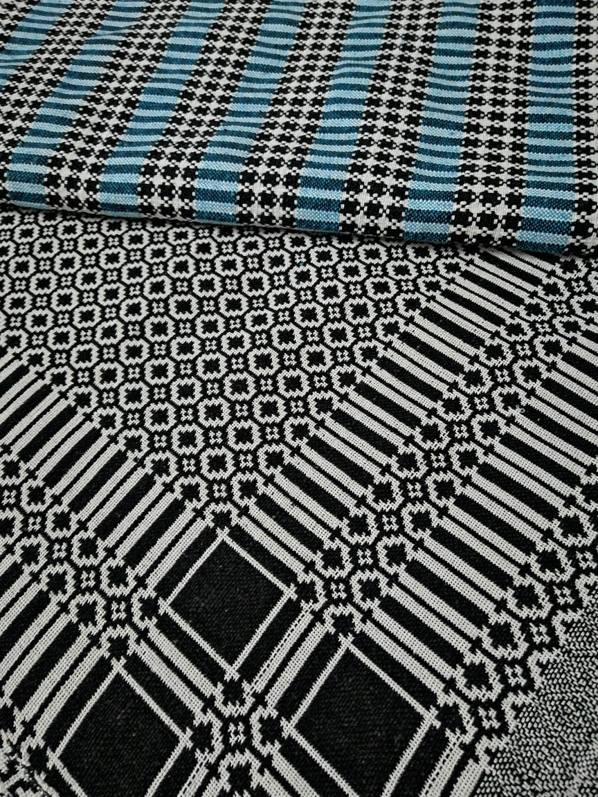 Close‑up of Black & White Cotton Majnu Khes showing geometric double‑cloth pattern and texture.