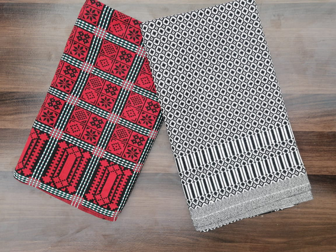 Close‑up of Black & White Cotton Majnu Khes showing geometric double‑cloth pattern and texture.